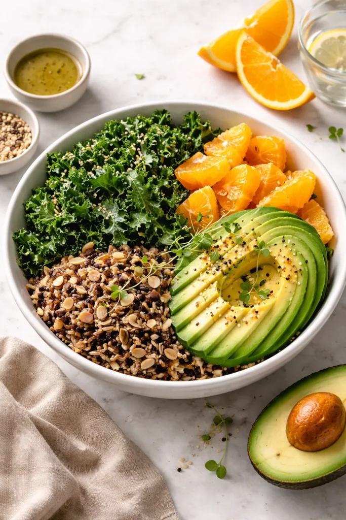 10 Clean Eating Recipes for the Whole Week 11 Buddha bowl with kale, avocado, orange segments and wild rice