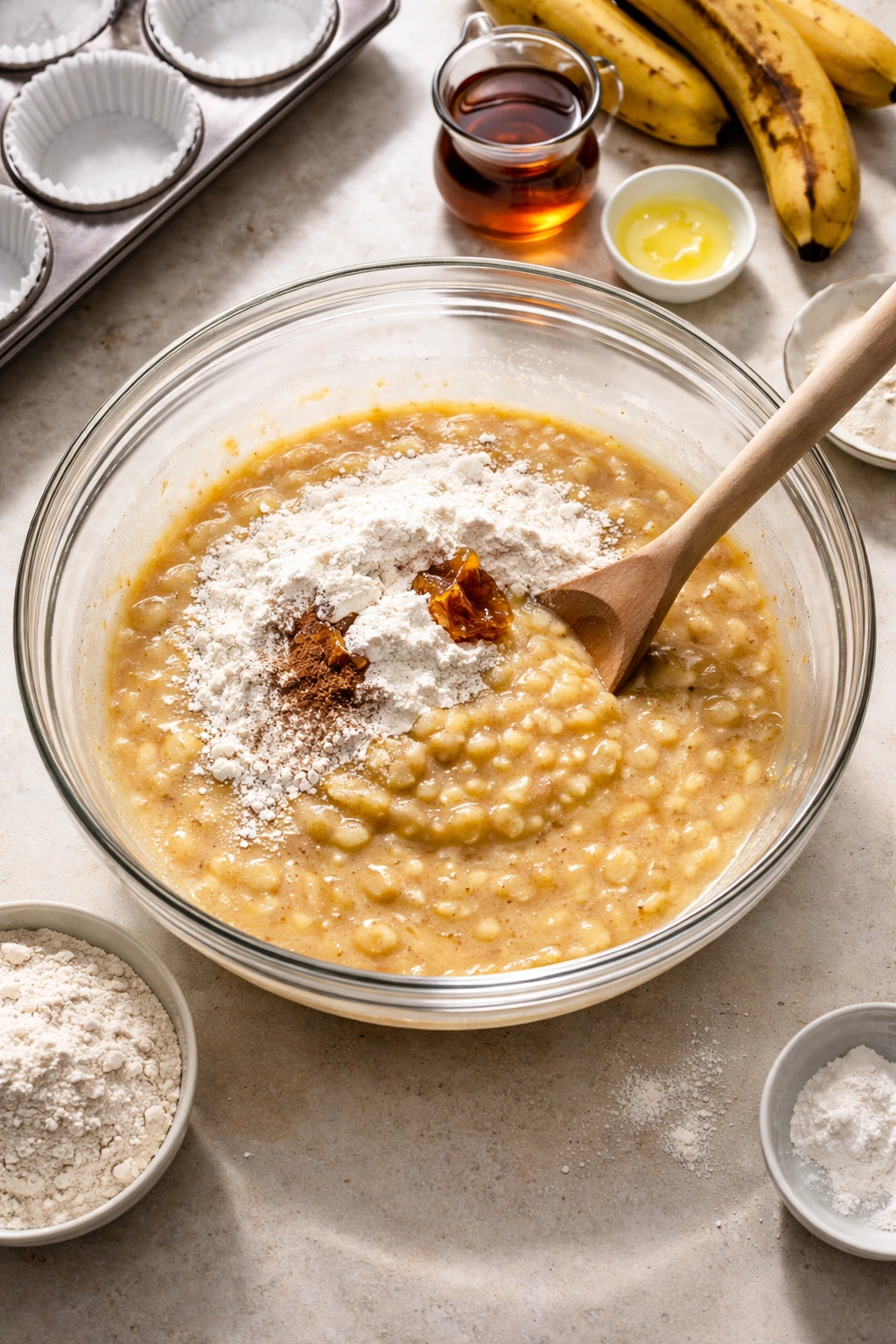 Bowl with banana batter in early mixing stage