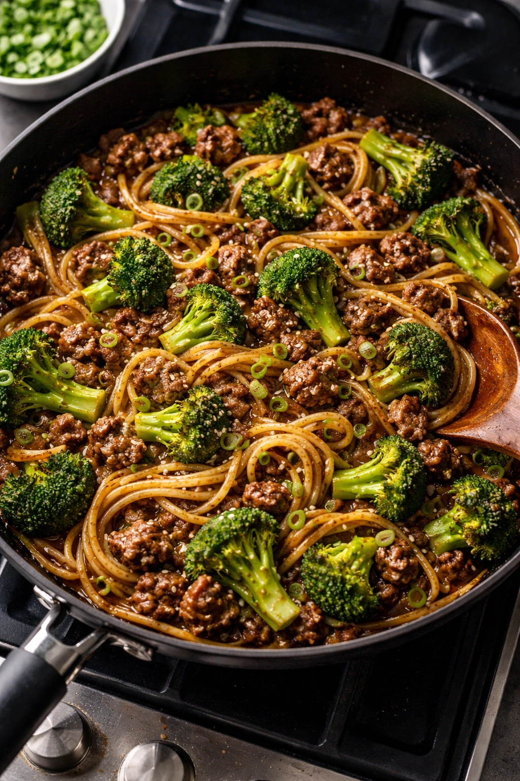 Beef and broccoli noodles in a skillet