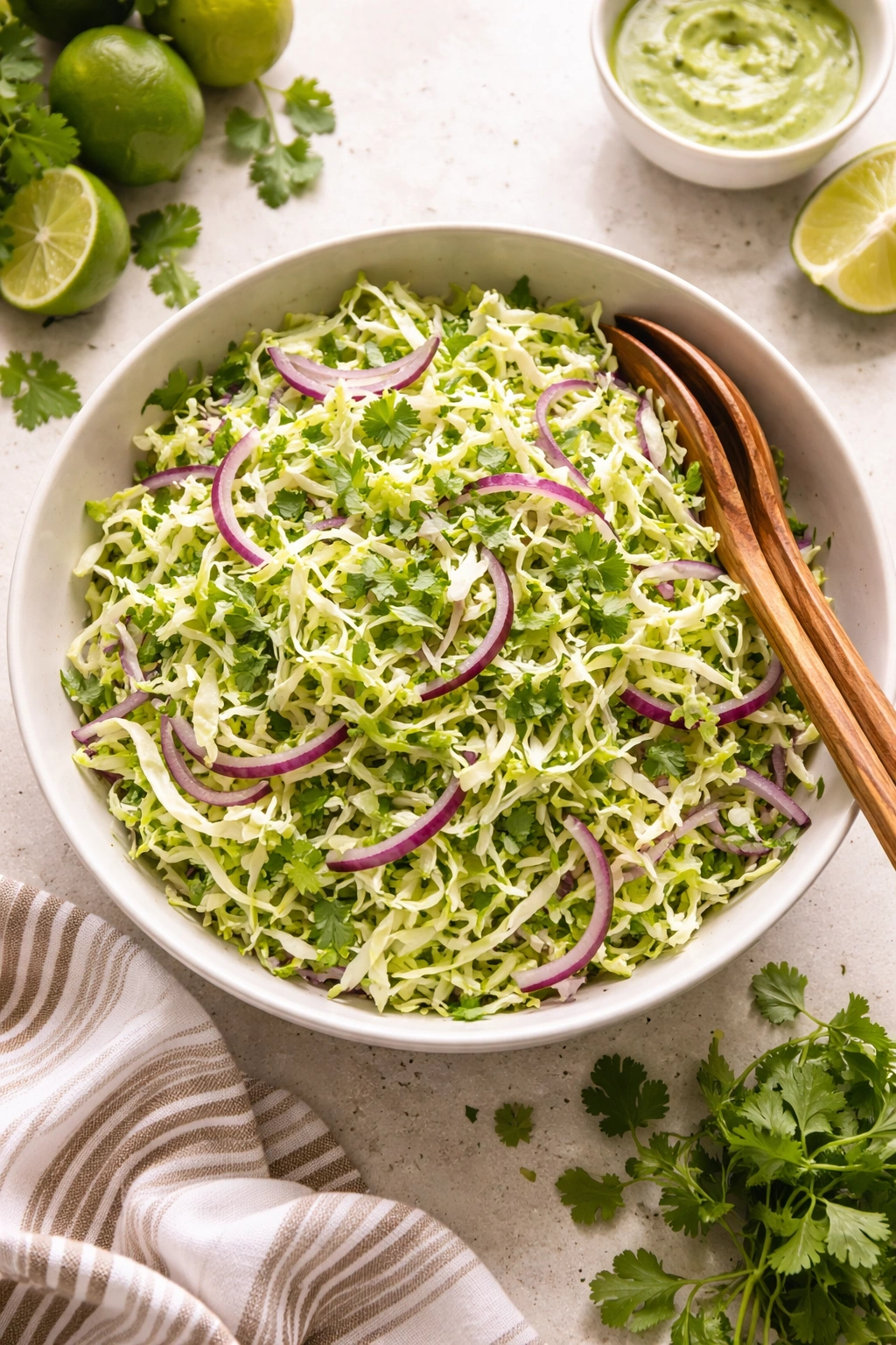 Cabbage slaw with red onion and cilantro in a bowl