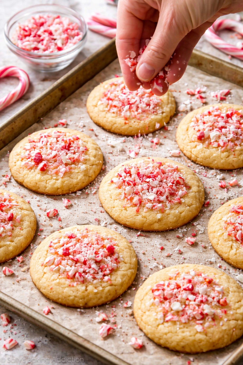 Cookies with candy cane topping embedded on surface
