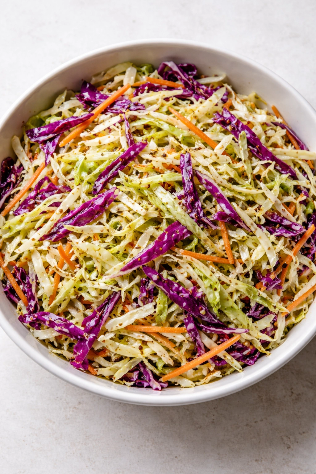 Coleslaw with vinegar-based dressing in a bowl