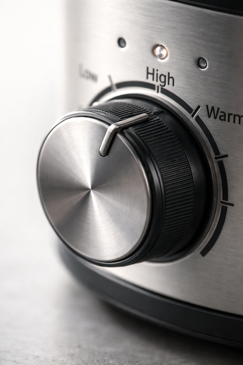 Close-up of a timer knob with tick marks and no numbers