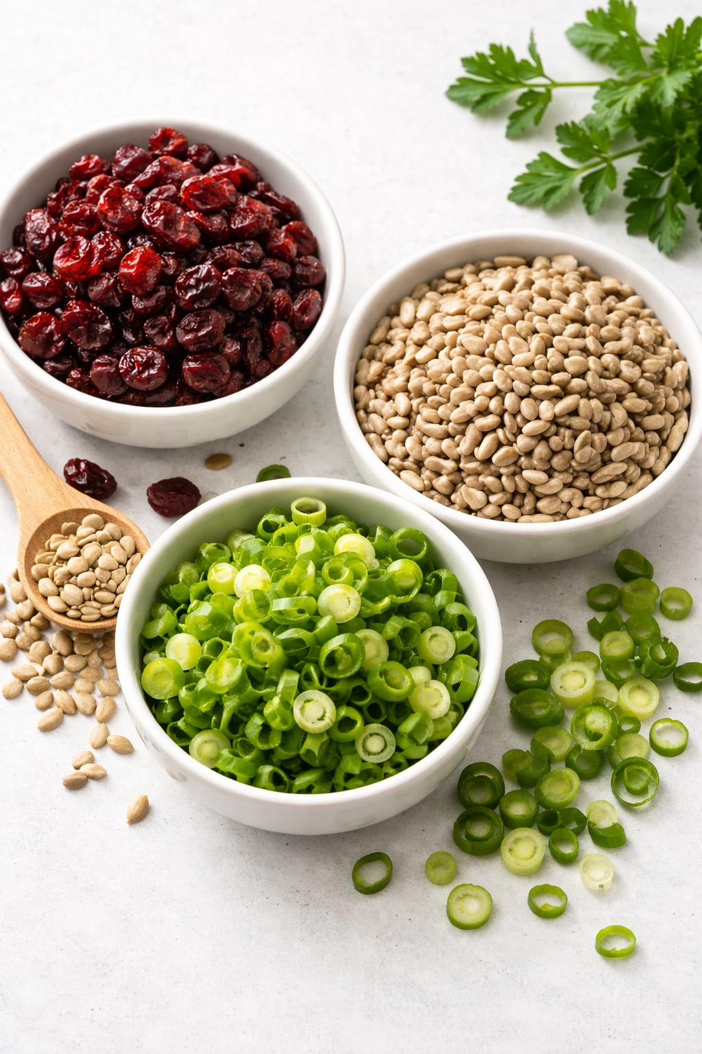 Cluster of cranberries, seeds, and scallions on plate