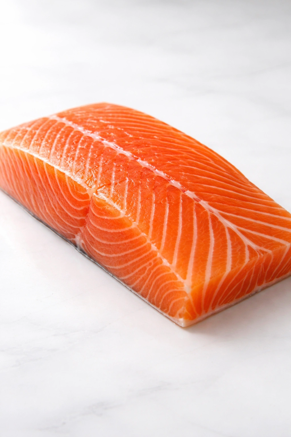 Fresh salmon fillet with vibrant color on clean surface