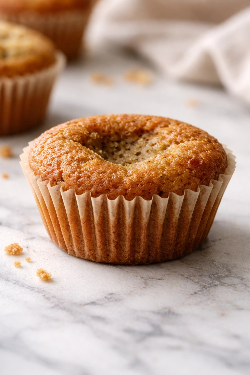 Muffin with sunken center indicating collapse