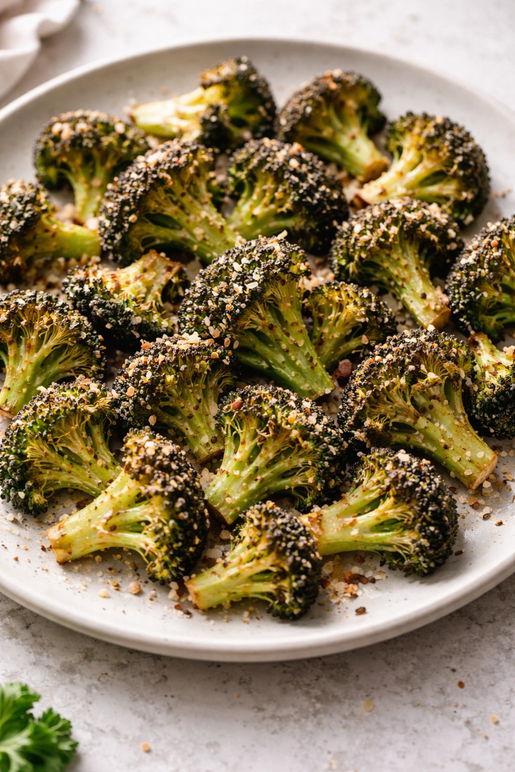 Close-up of crispy parmesan roasted broccoli on a plate