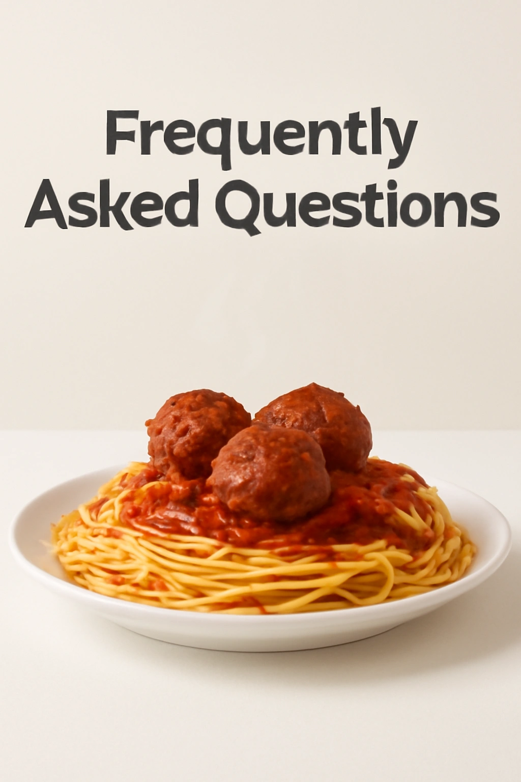 Steaming spaghetti and meatballs in a clean setting