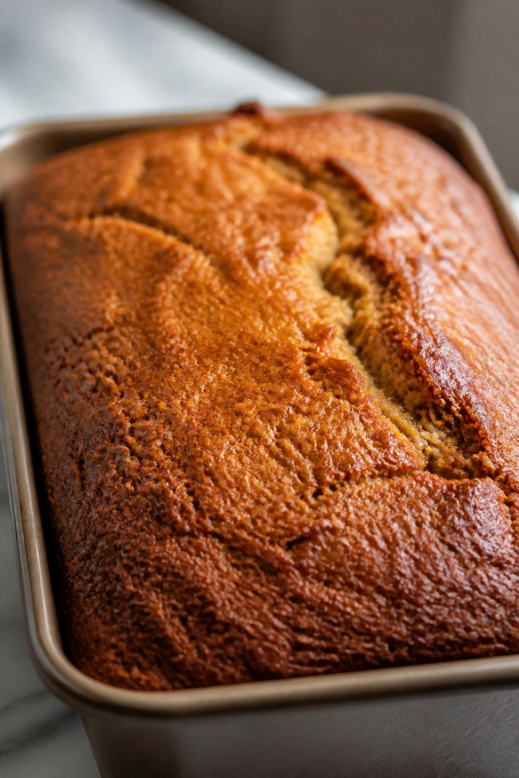 Golden-brown banana bread crust with even coloration