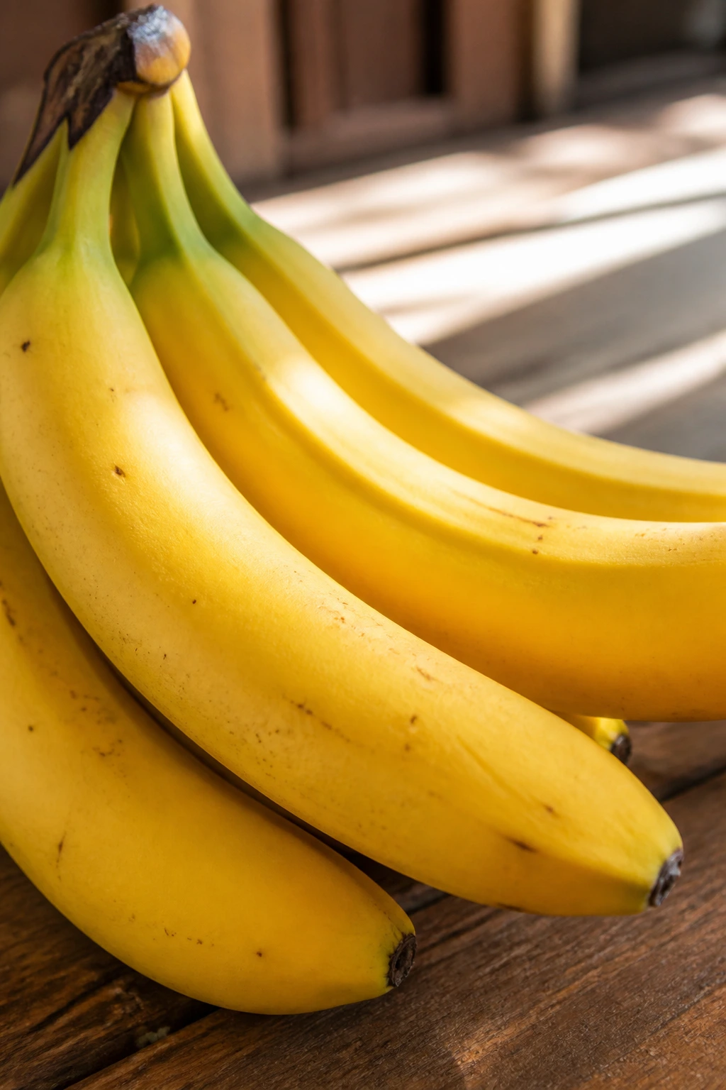 Why Are My Bananas Still Green After 2 Weeks Or More? 4 Cavendish banana filling the frame with ripe yellow peel