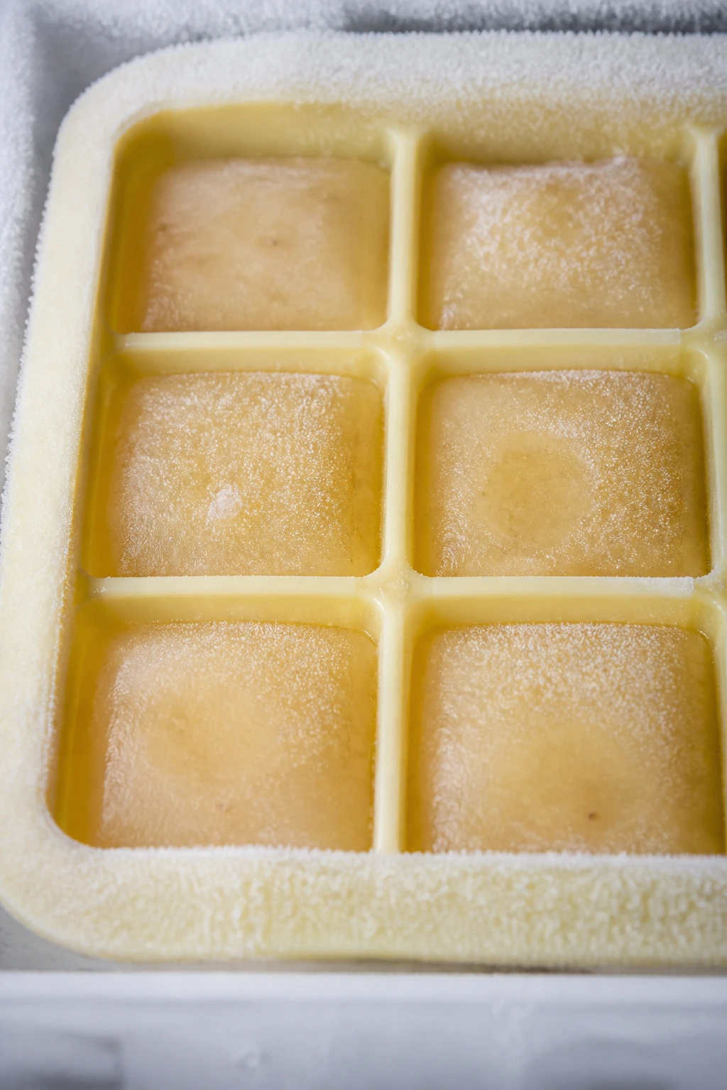 How Long Is Banana Puree Good In Fridge? & Storage Tips 3 Banana puree cubes in silicone ice tray for freezing