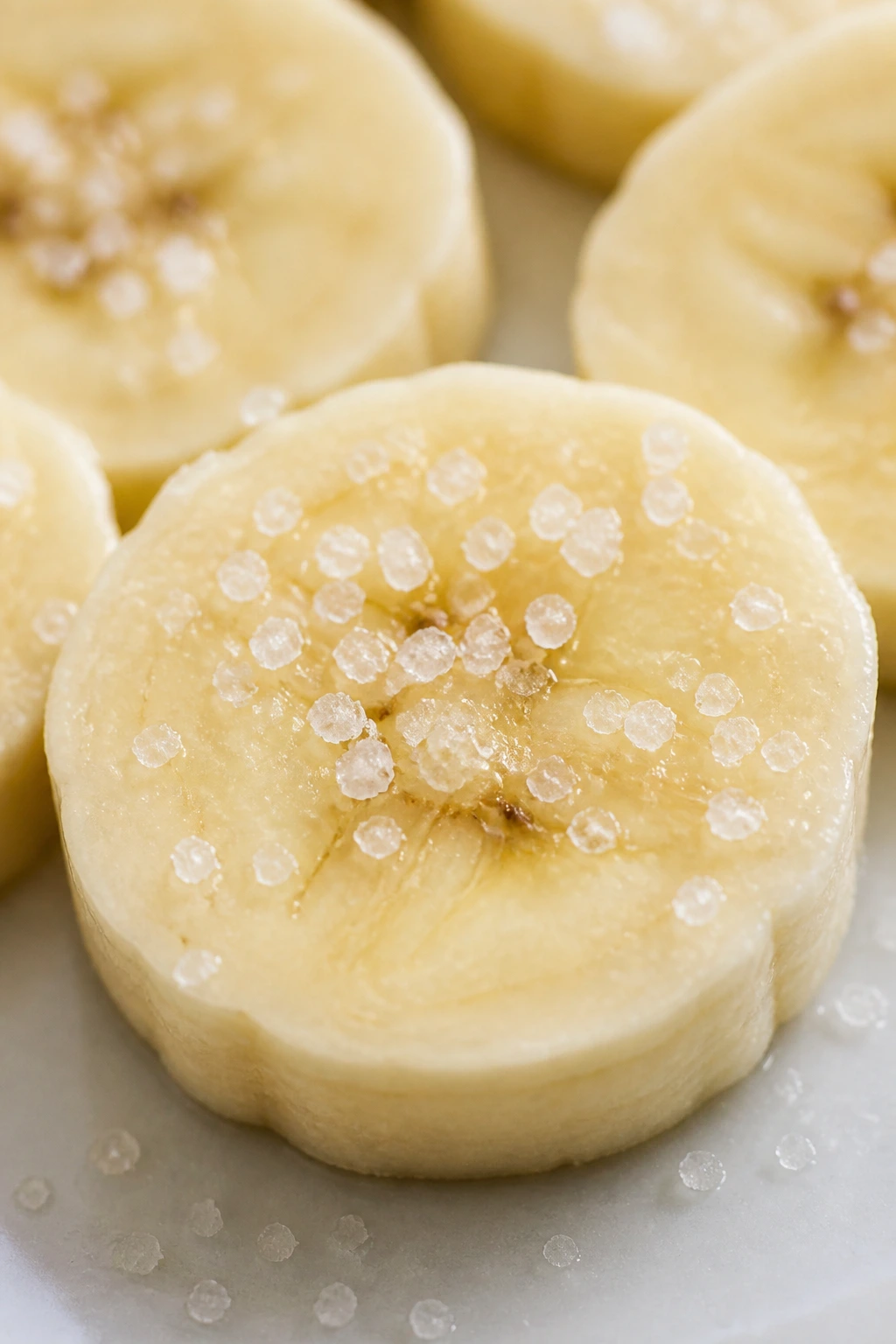 Banana slice with salt crystals to slow browning