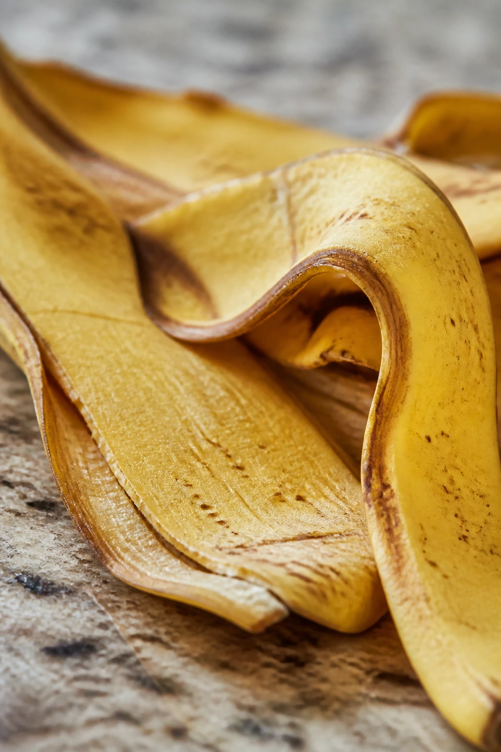 Dog-Friendly Treats: Are Banana Peels Good For Dogs? 3 Close-up of a yellow banana skin on a kitchen counter