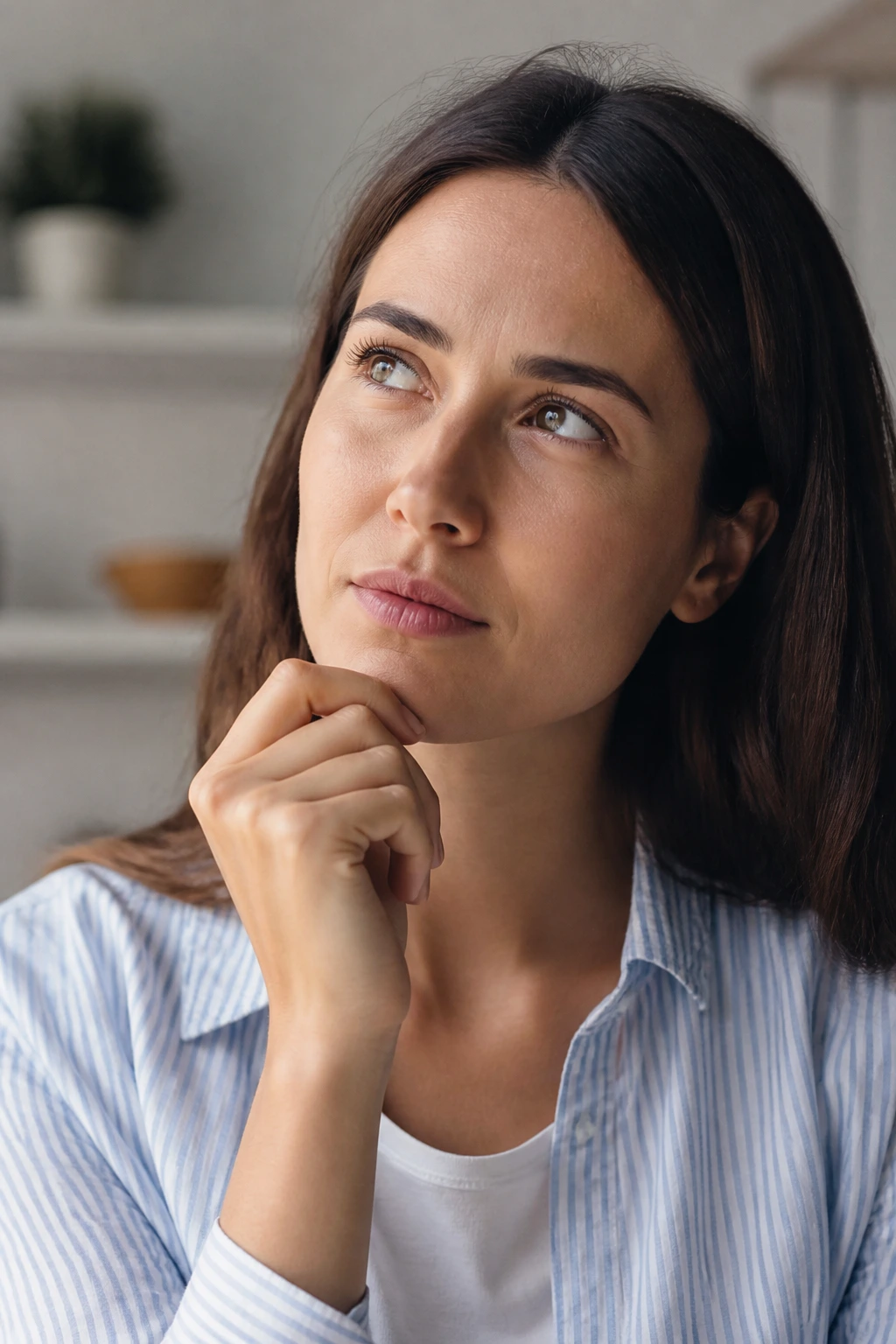 Thoughtful adult considering common questions about fruit and teeth.