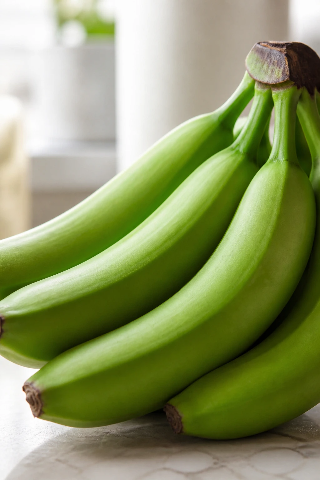 Why Are My Bananas Still Green After 2 Weeks Or More? 5 Very green firm banana filling the frame