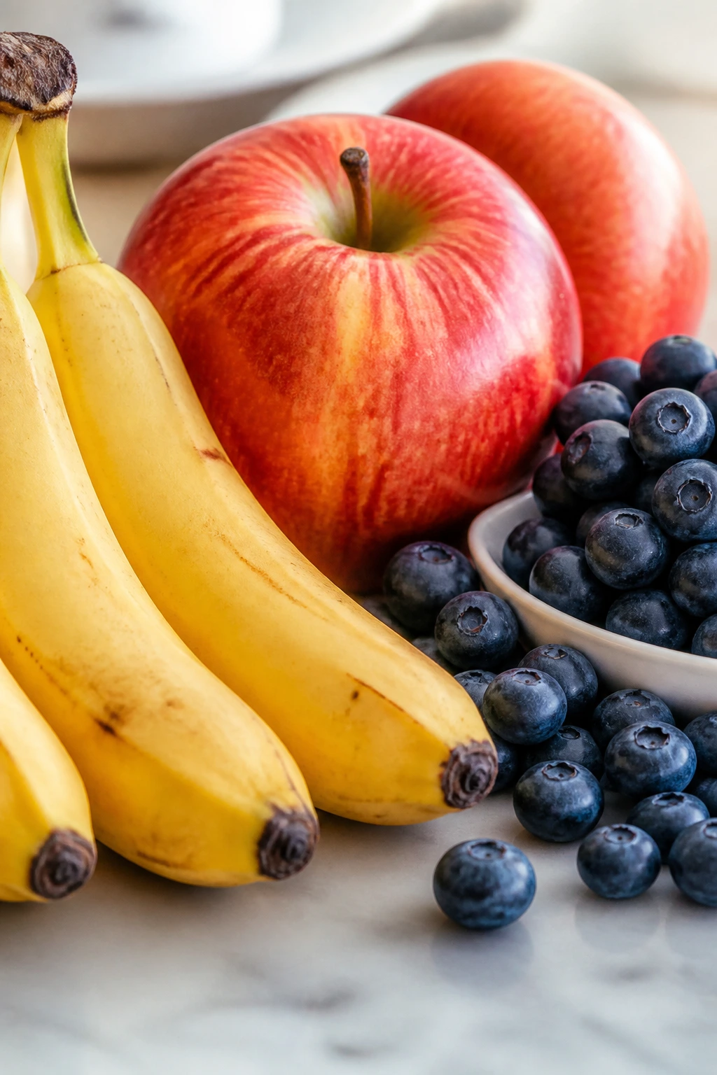 Close-up of assorted fruits filling the frame on a kitchen counter
