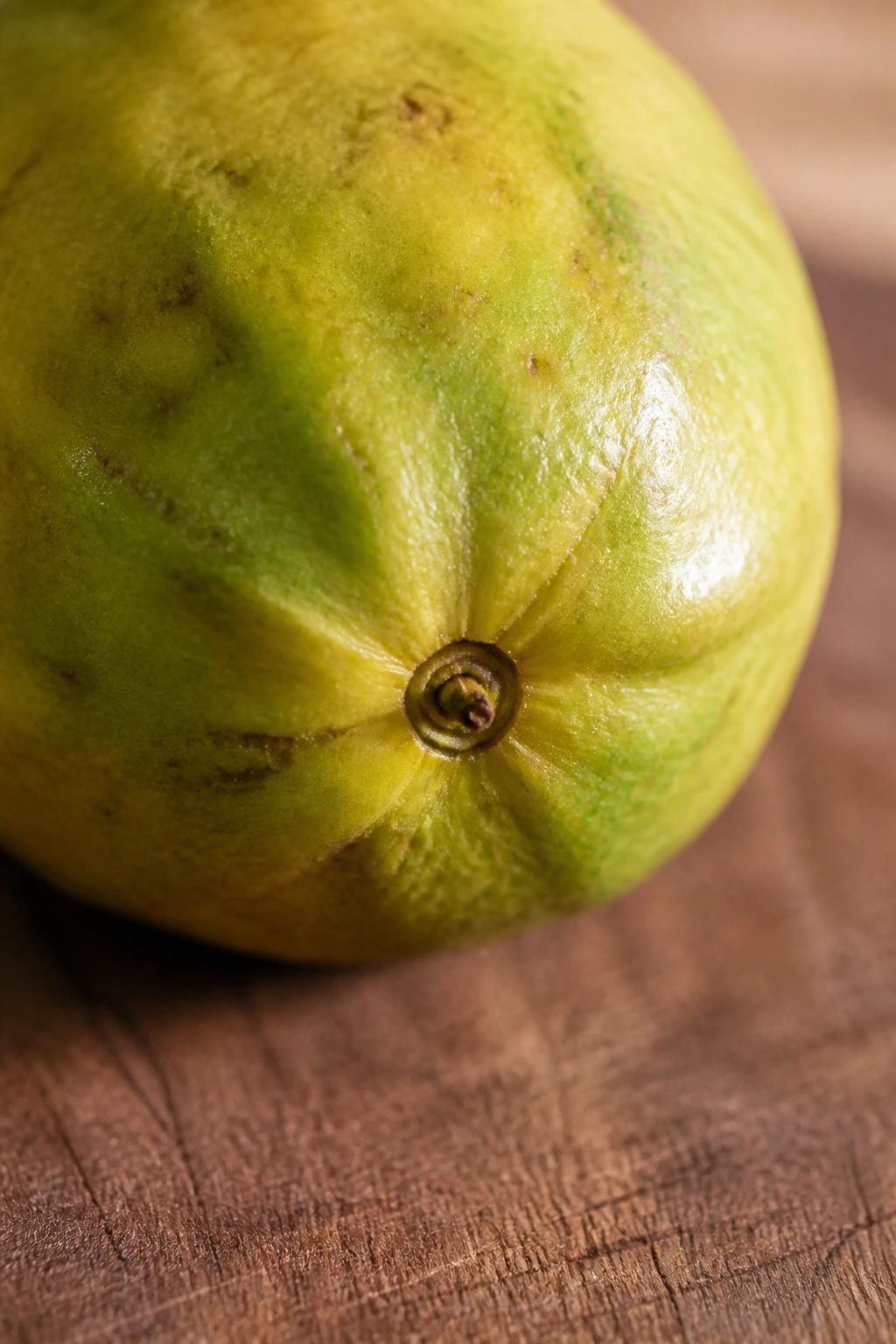 How Can You Tell If A Guava Is Ripe: Indicators to Look For 4 Stem area of a guava showing green to yellow skin near the stem