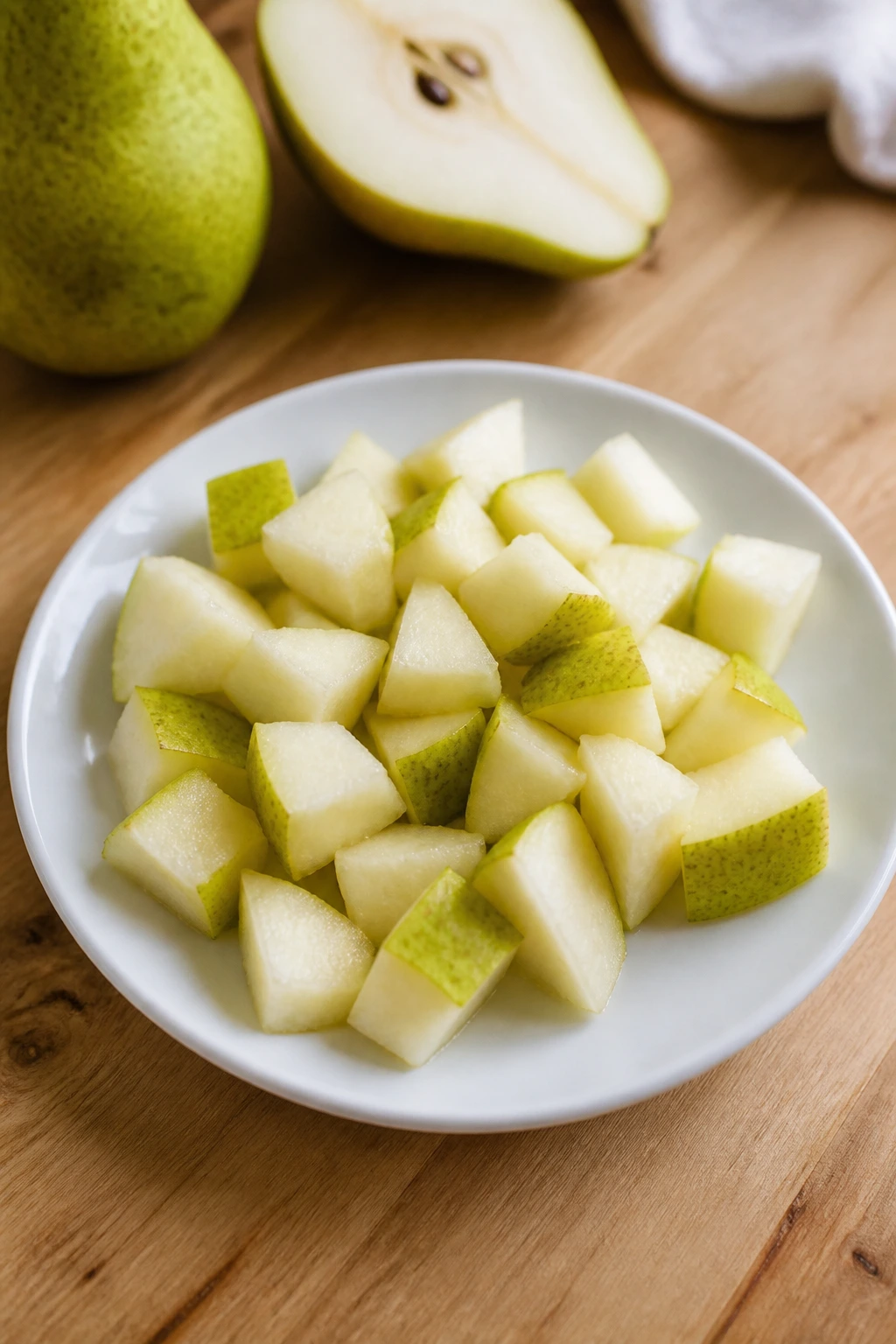 Can Bearded Dragons Eat Pears? Are They A Safe Choice? 13 Pear pieces cut into bite-sized chunks on a plate