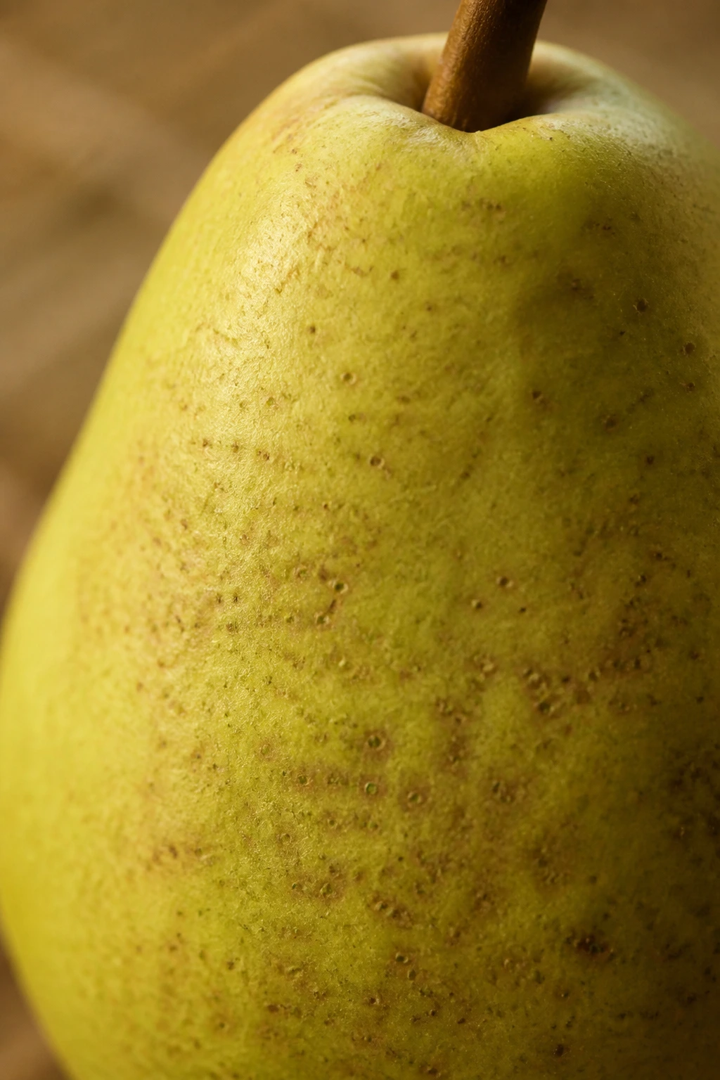 Can You Eat Pear Skin? Find Out If You Can Eat It! 5 Pear skin occupying most of the frame with vivid color and texture.
