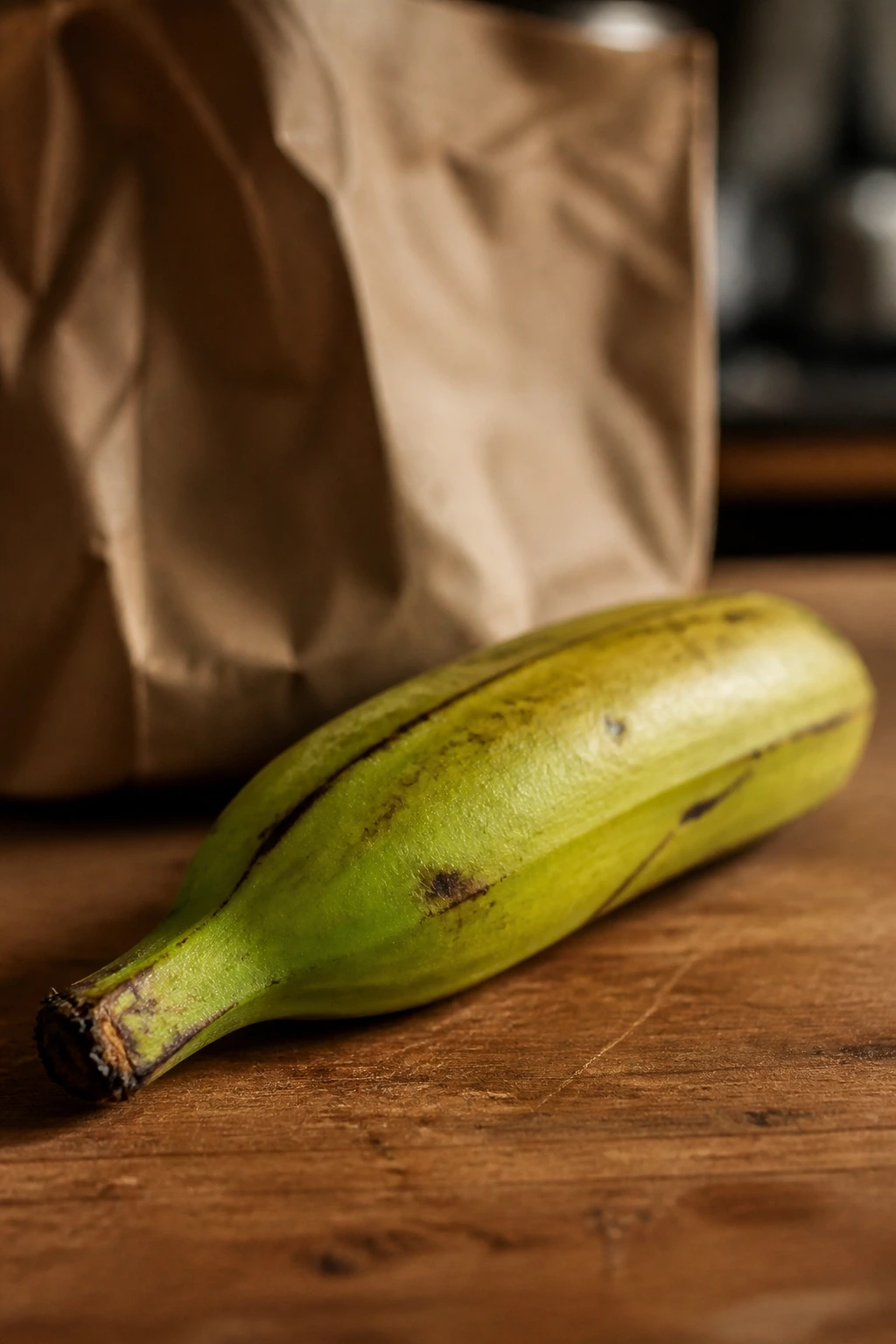 Plantain on counter with bag in background hinting at ripening methods