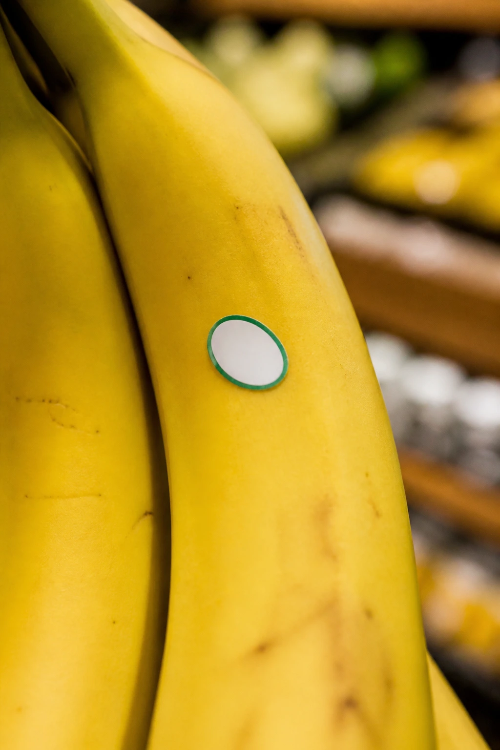 Understanding What Stickers on Fruits and Vegetables Mean 3 Small secondary sticker on a banana in a grocery store