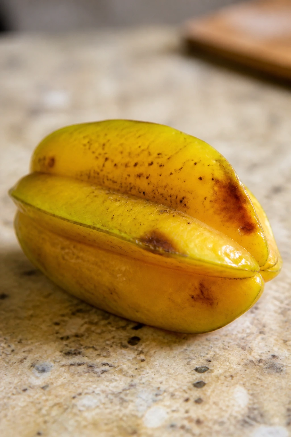 How To Store Star Fruit Properly For Longer Shelf Life 3 Star fruit showing spoilage signs like brown spots and softness.
