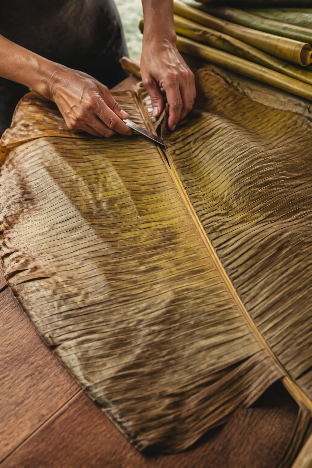 Banana leaf prepared on wooden counter in natural daylight
