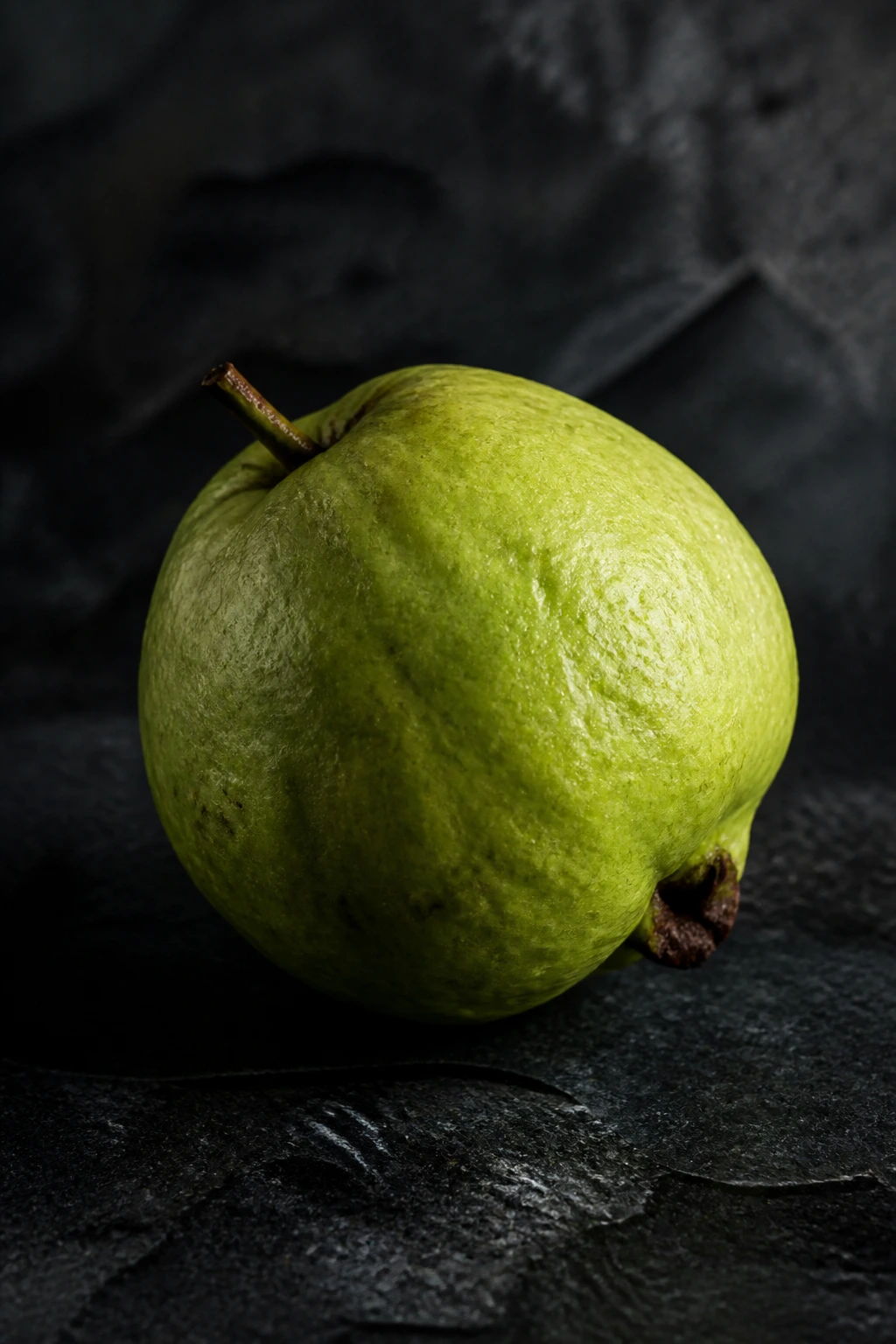Is Guava Fruit Good For High Blood Pressure? Benefits, & More 6 Single guava on dark background with moody lighting for precautions